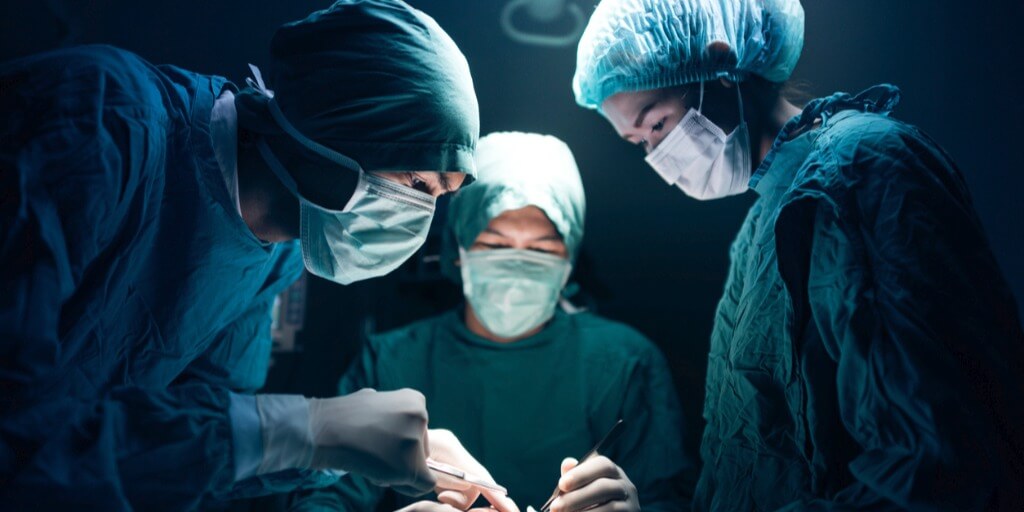 medical team performing surgery picture id498861644